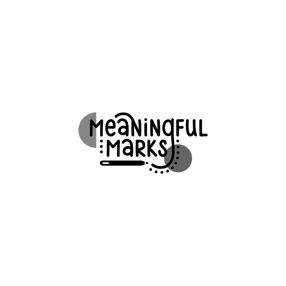 Logo with the words "Meaningful Marks" in playful white font, surrounded by yellow, blue, and white design elements on a dark background.