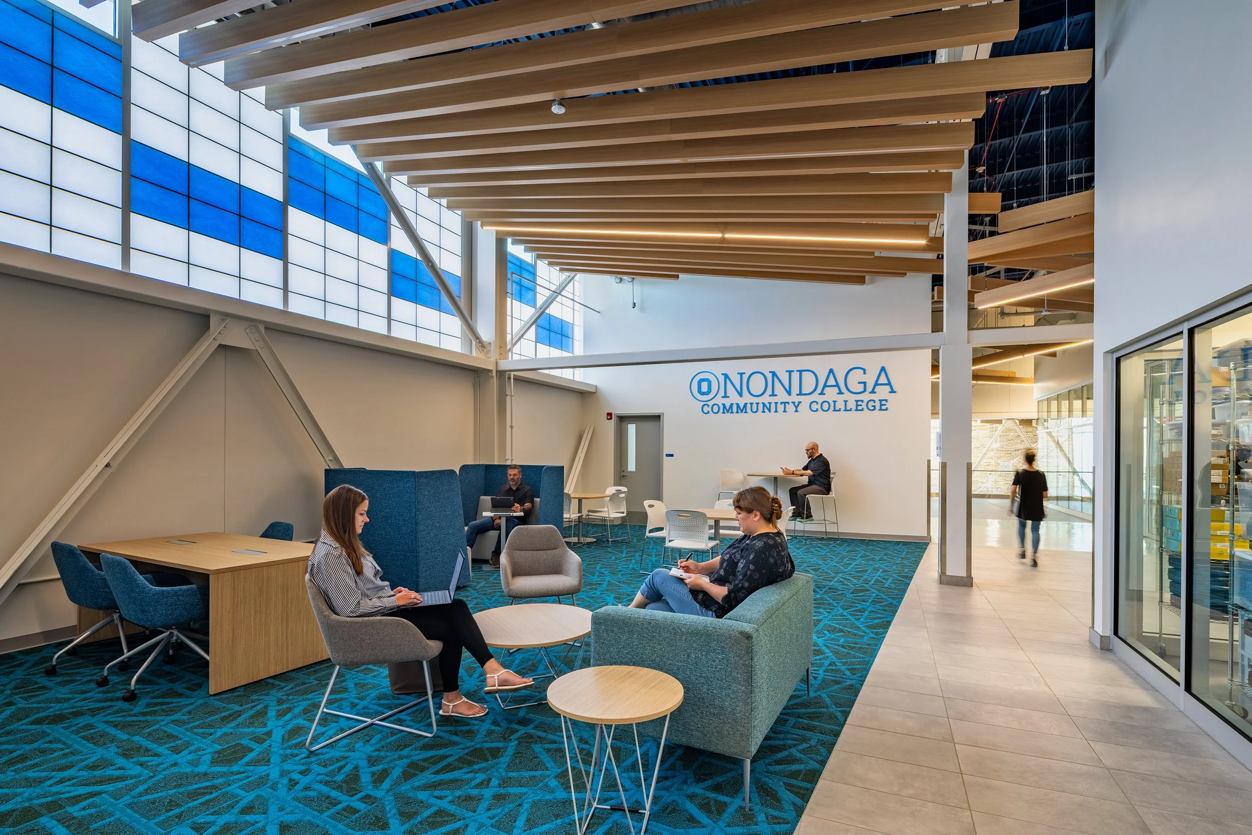 Student lounge with collaborative seating adjacent to academic and laboratory spaces.