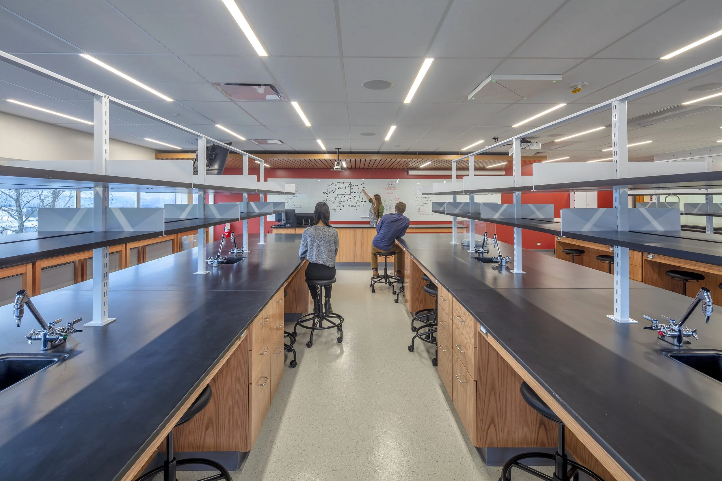 Teaching laboratory with fixed lab benches, integrated sinks and utilities, and collaborative instructional space.