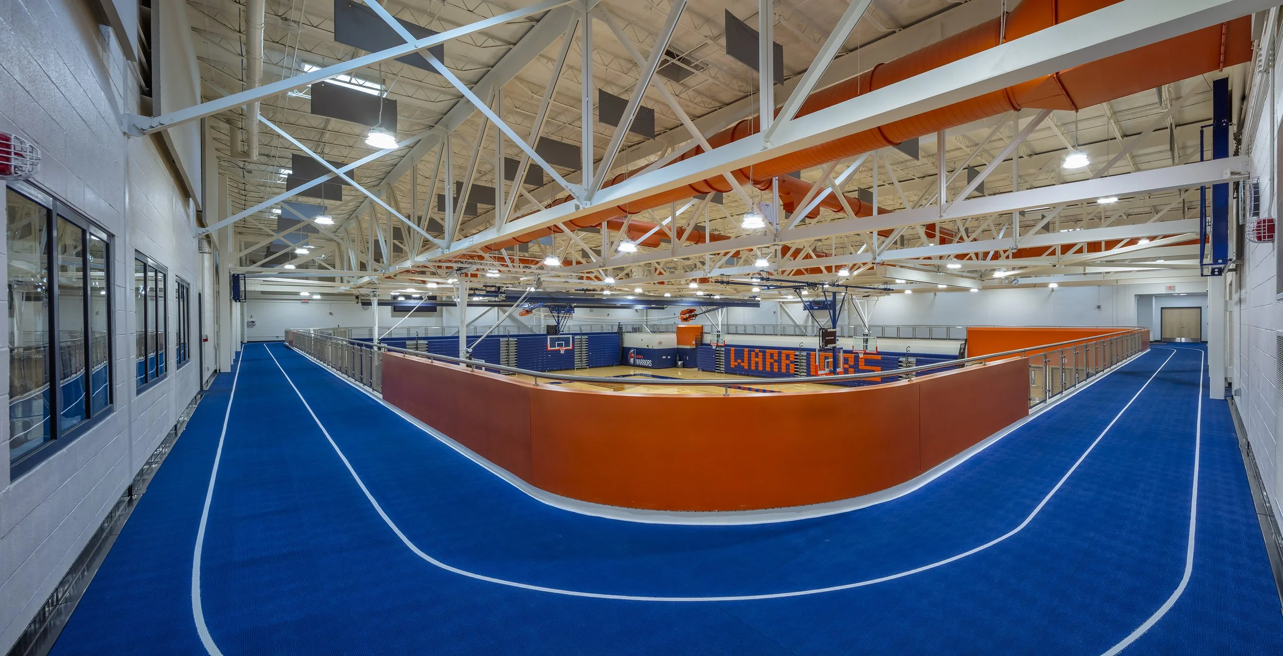 Elevated indoor running track overlooking the Liverpool High School gymnasium.