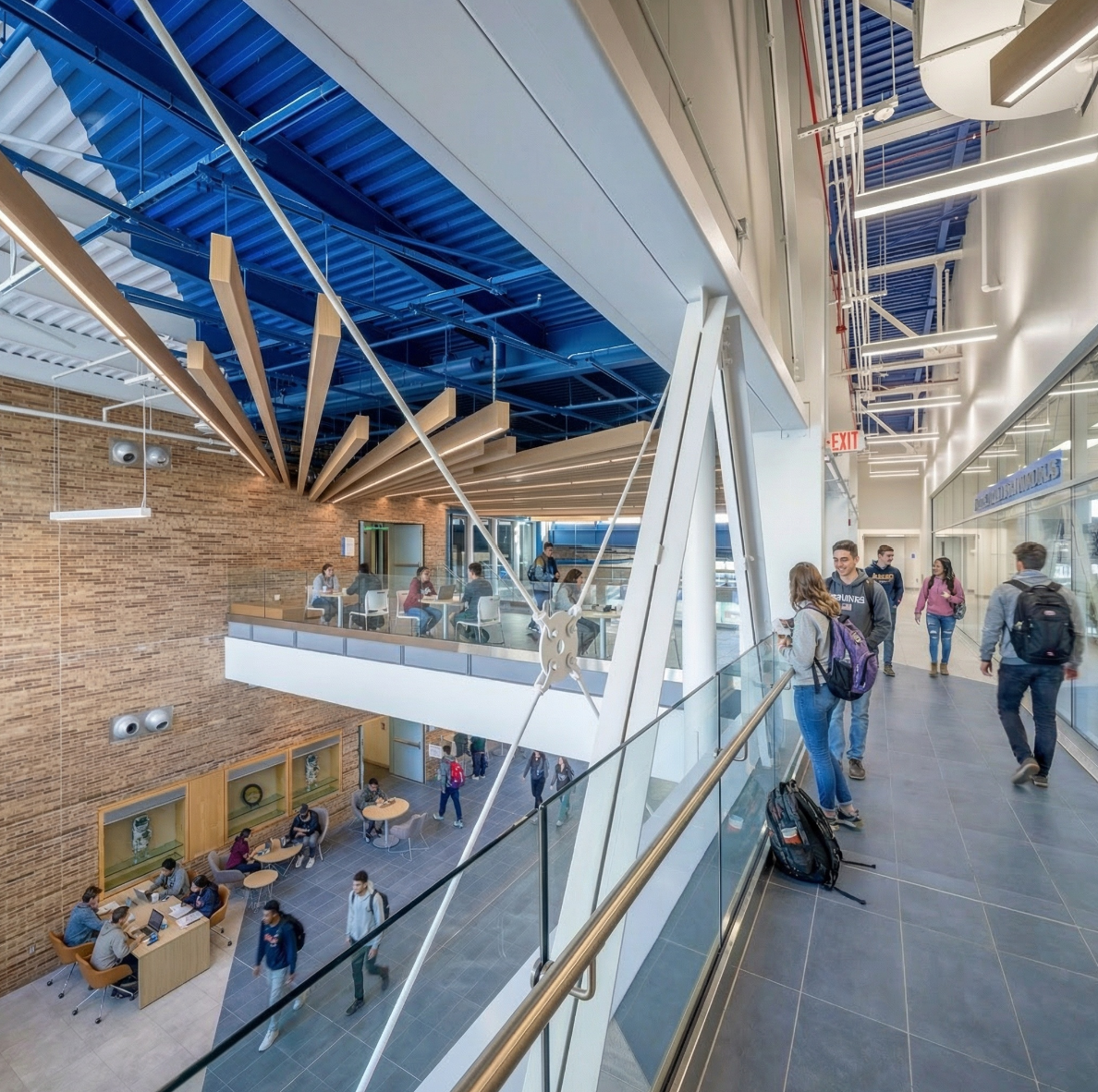 Interior collaboration bridge overlooking the central atrium at Whitney Applied Technology Center.
