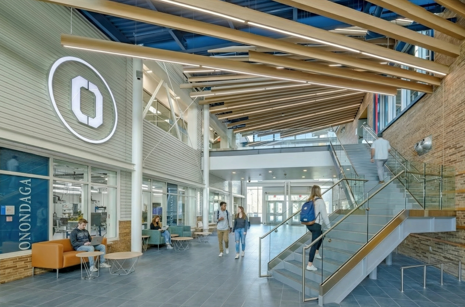 Central atrium with open stair, student seating, and collaborative learning spaces.