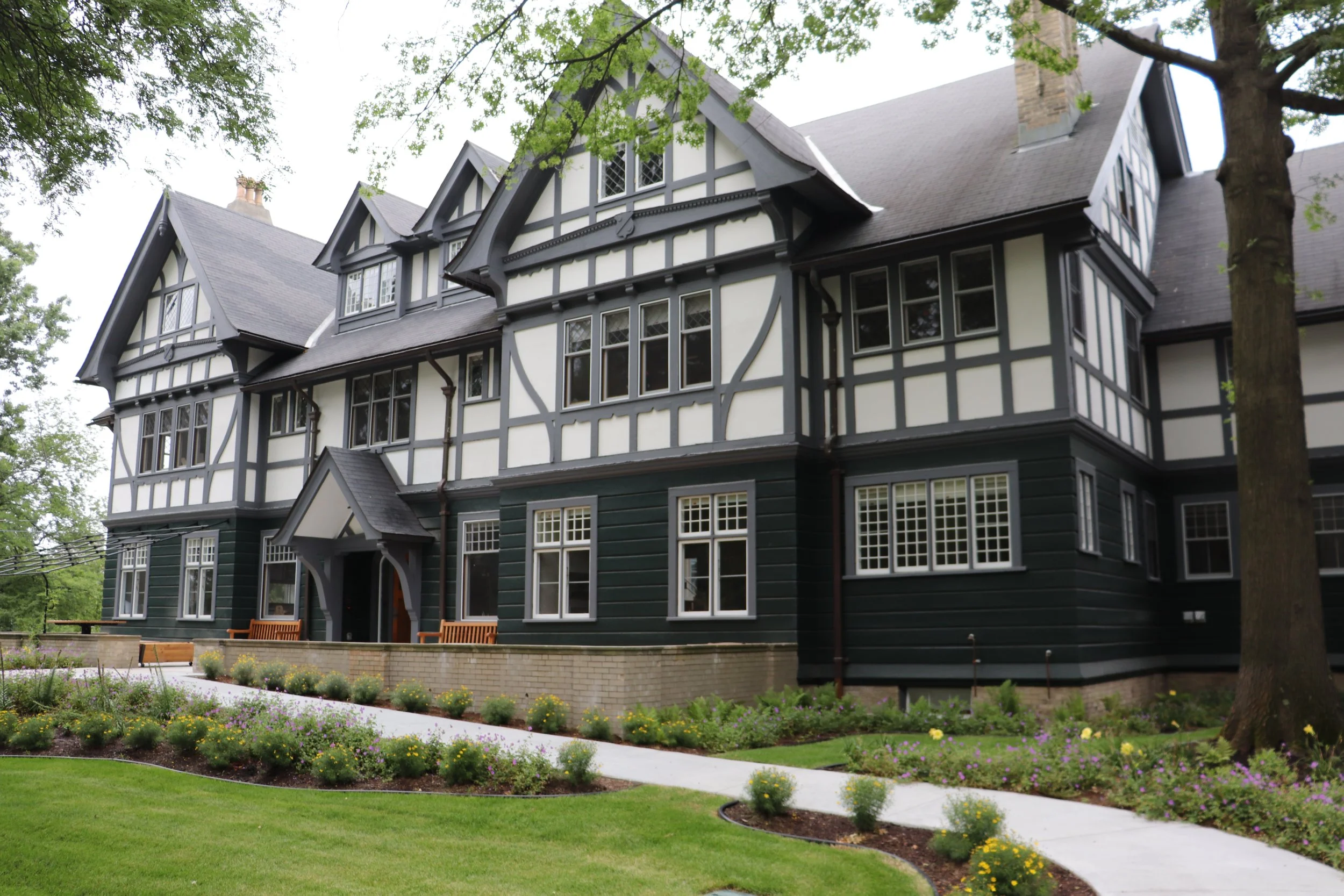 Historic exterior of the Boston University Children’s Center, surrounded by landscaped grounds and mature trees.