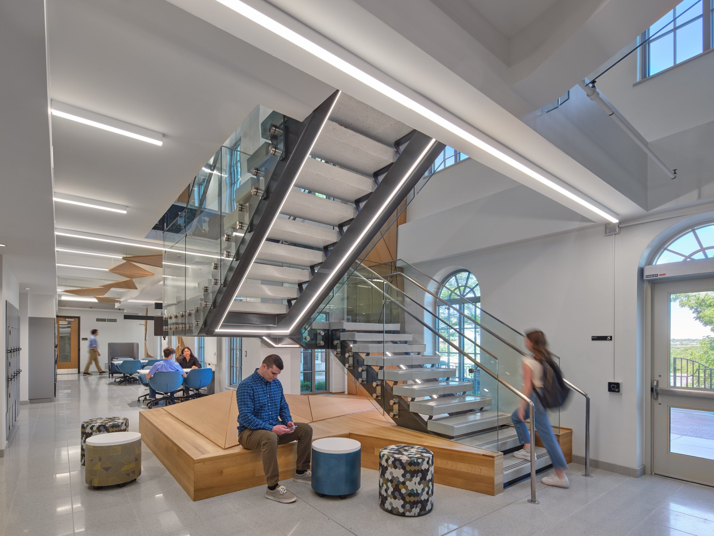 Open stair and commons area at Silverman Hall with integrated seating, collaborative spaces, and contemporary architectural detailing.