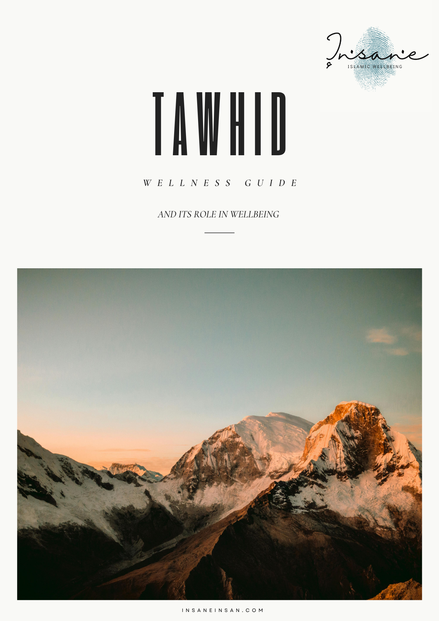 Snow-capped mountains during sunset with a range of peaks under a pastel sky.