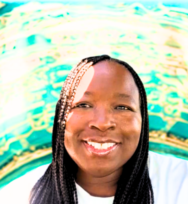 Close-up of a smiling woman with long braided hair, against a bright, colorful background. 
Marie Cole Experience speaks to real people with real weight loss struggles and remind you that change is possible.