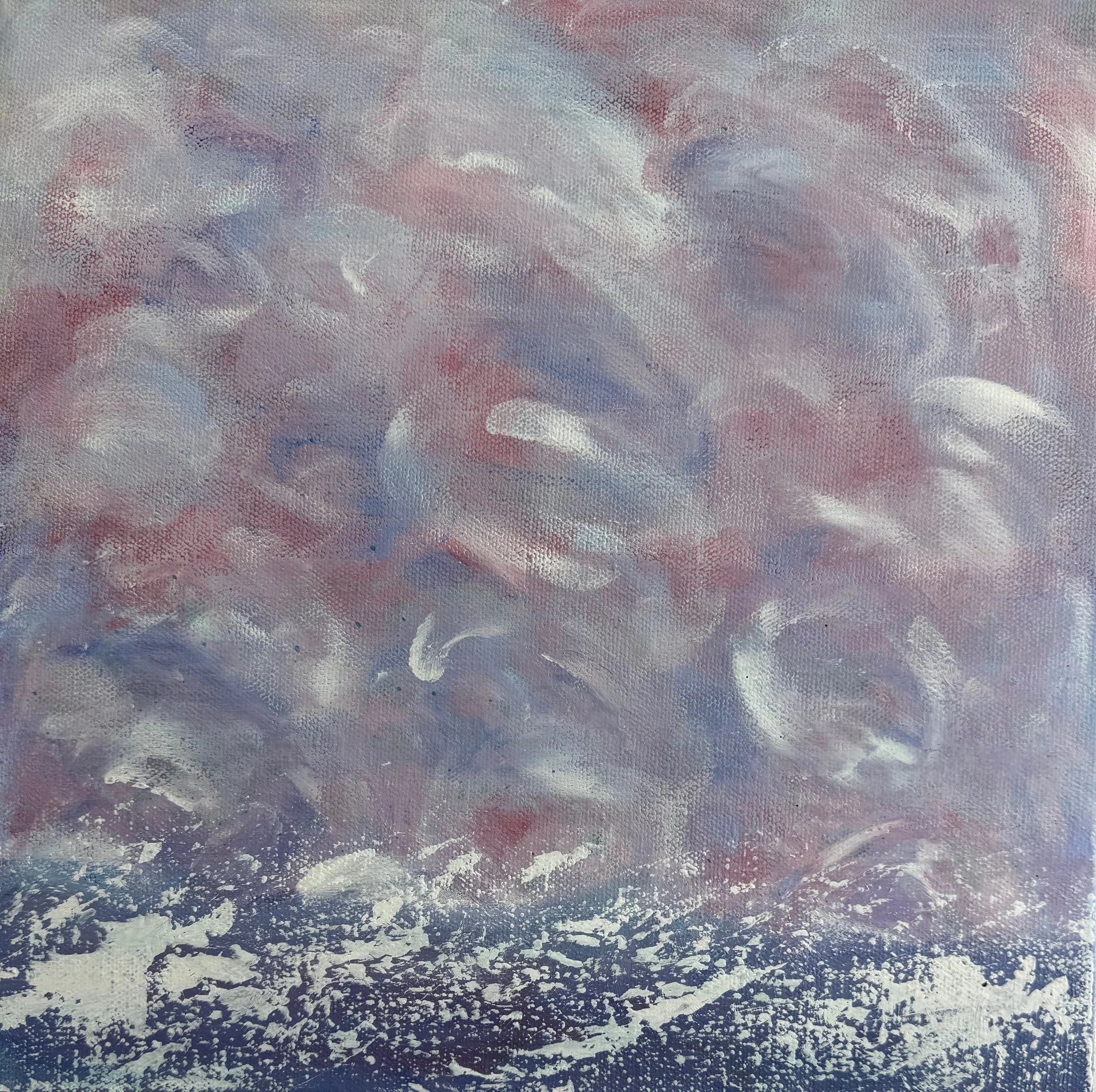The image shows the view from an airplane window, looking at an aerial view of the ocean with waves and whitecaps, and some clouds overhead.
