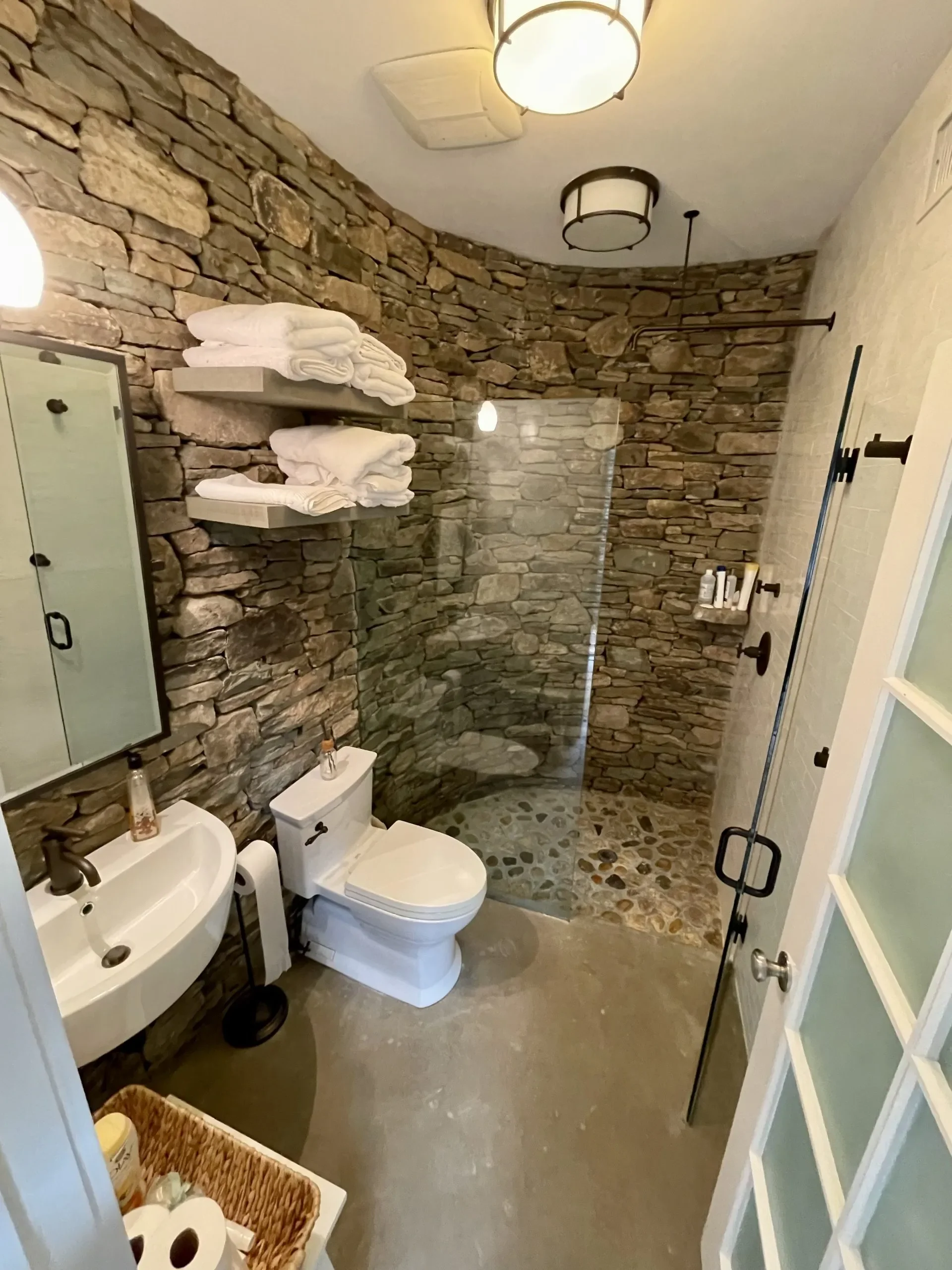 Custom bathroom remodel in North Texas by Gold Oak Remodeling featuring stone shower walls and modern fixtures.