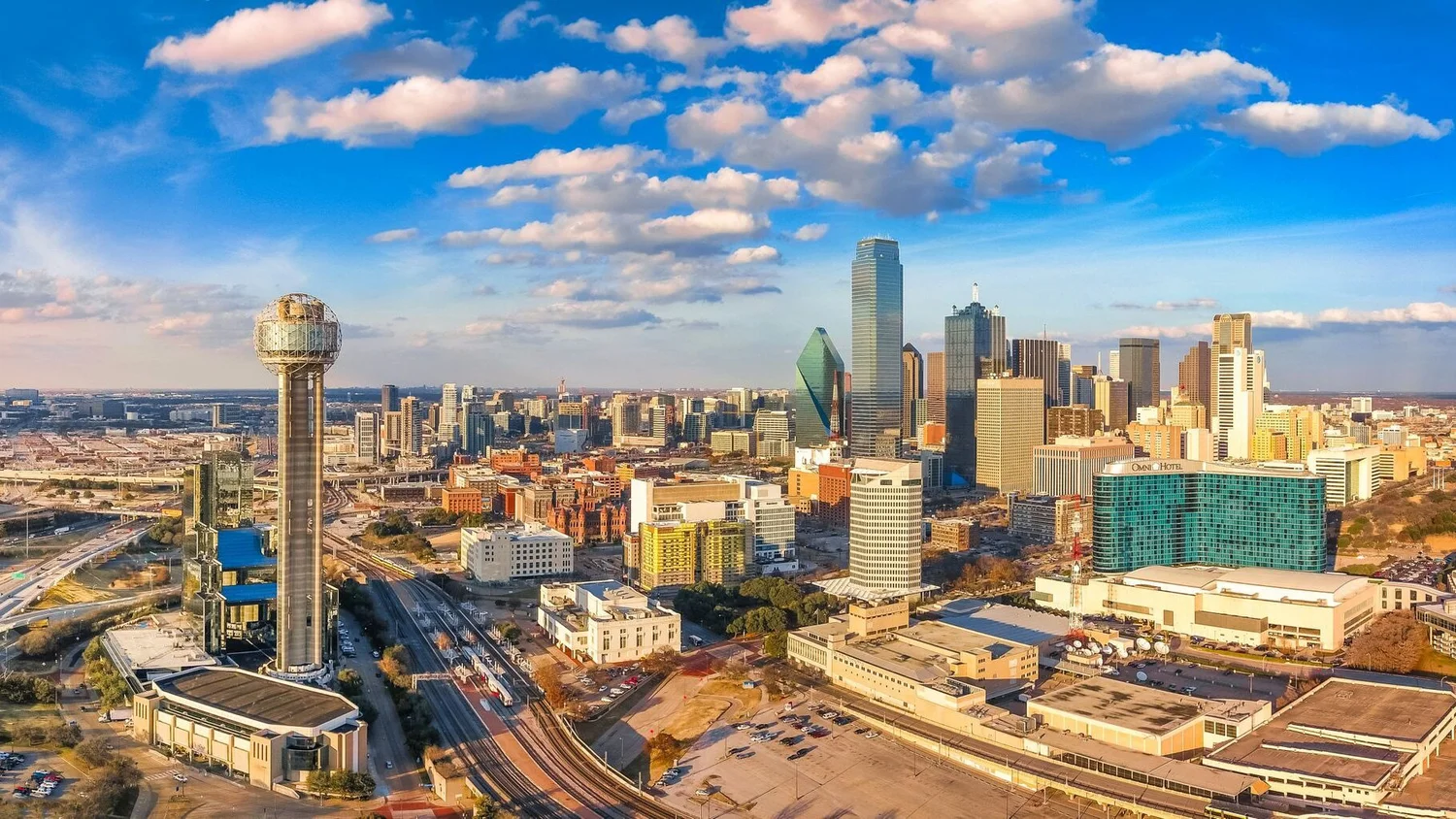 Aerial view of the Dallas skyline and surrounding neighborhoods
