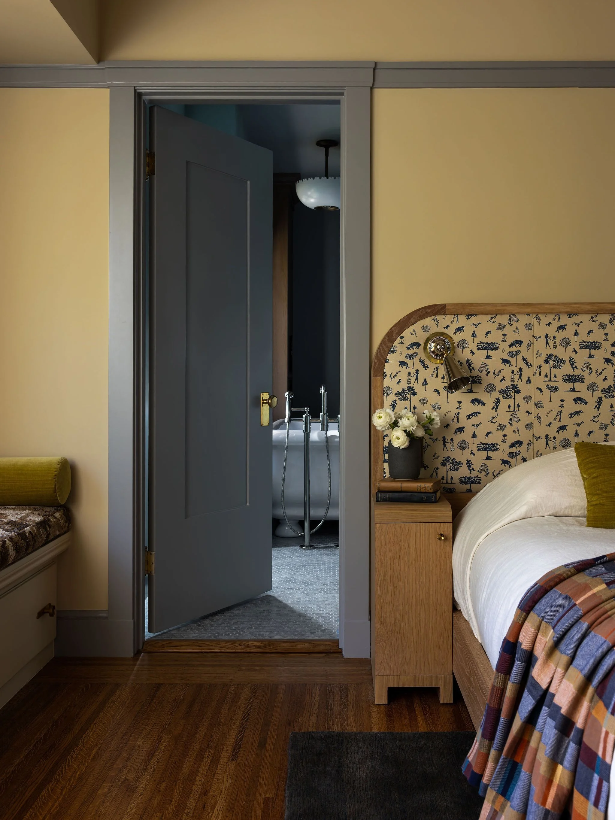 The layout of this one was tricky. We custom built this bed to fit the exact 99&rdquo; wall between the two doors in the room (bathroom door was scooted over to help). Sweet little integrated nightstands allowed for some bedside storage. We built-in 