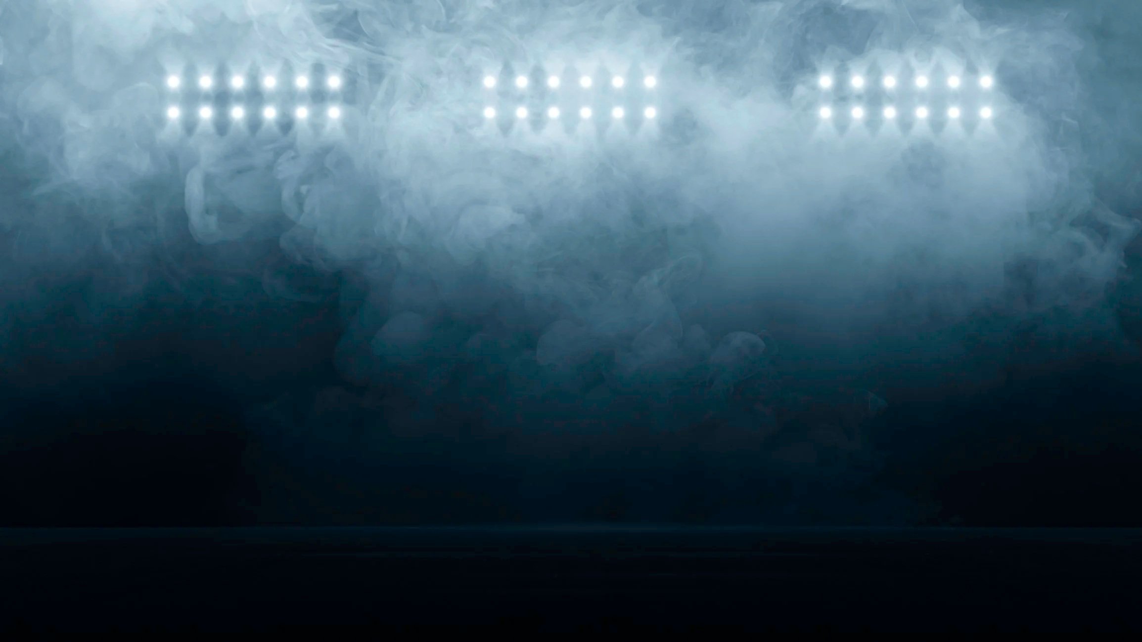 Smoke or fog with bright lights reflecting off the surface.