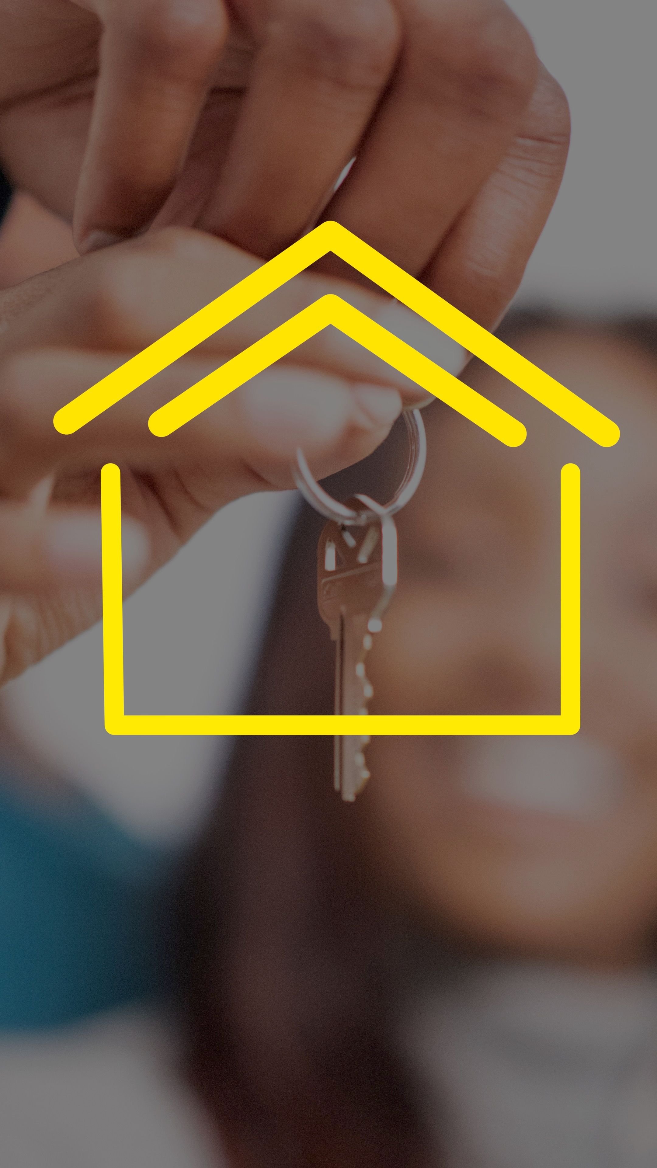 Close-up of a person holding a key with a house icon overlay in yellow