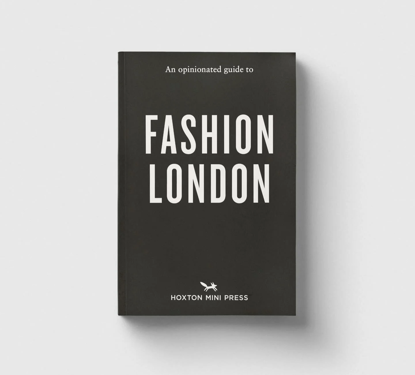 Book titled 'An opinionated guide to FASHION LONDON' by Hoxton Mini Press with a minimalist black cover and white text.