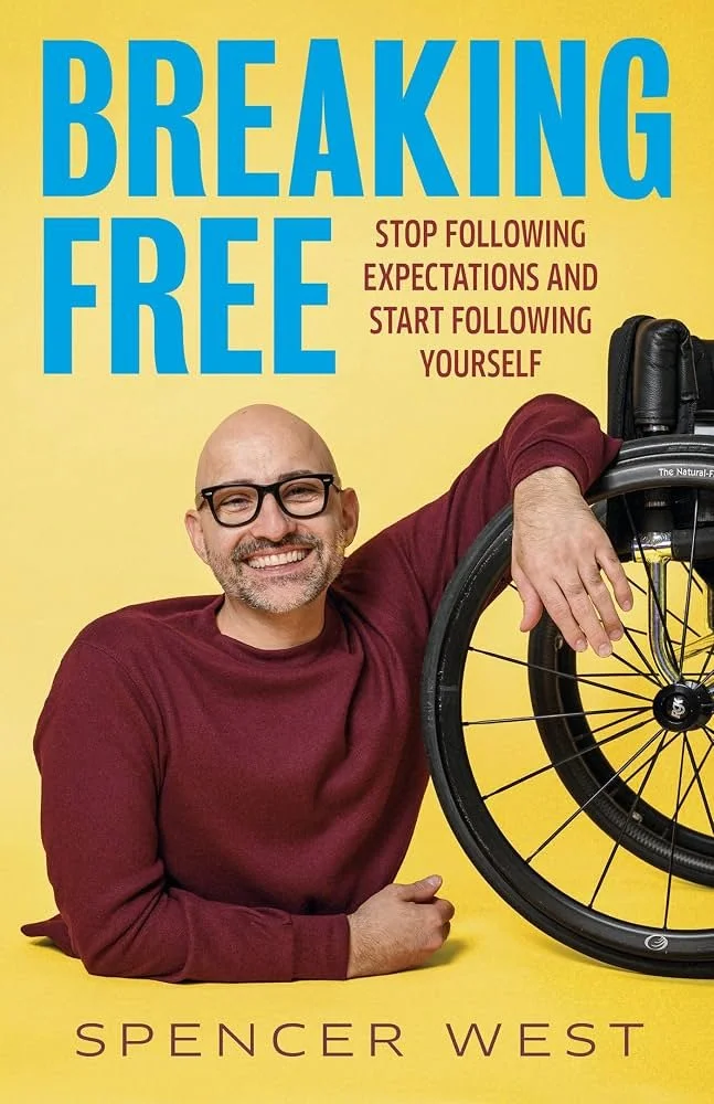 Book cover titled "Breaking Free" by Spencer West, featuring a smiling man in glasses and a maroon sweater sitting beside a wheelchair on a yellow background, with the subtitle "Stop following expectations and start following yourself."