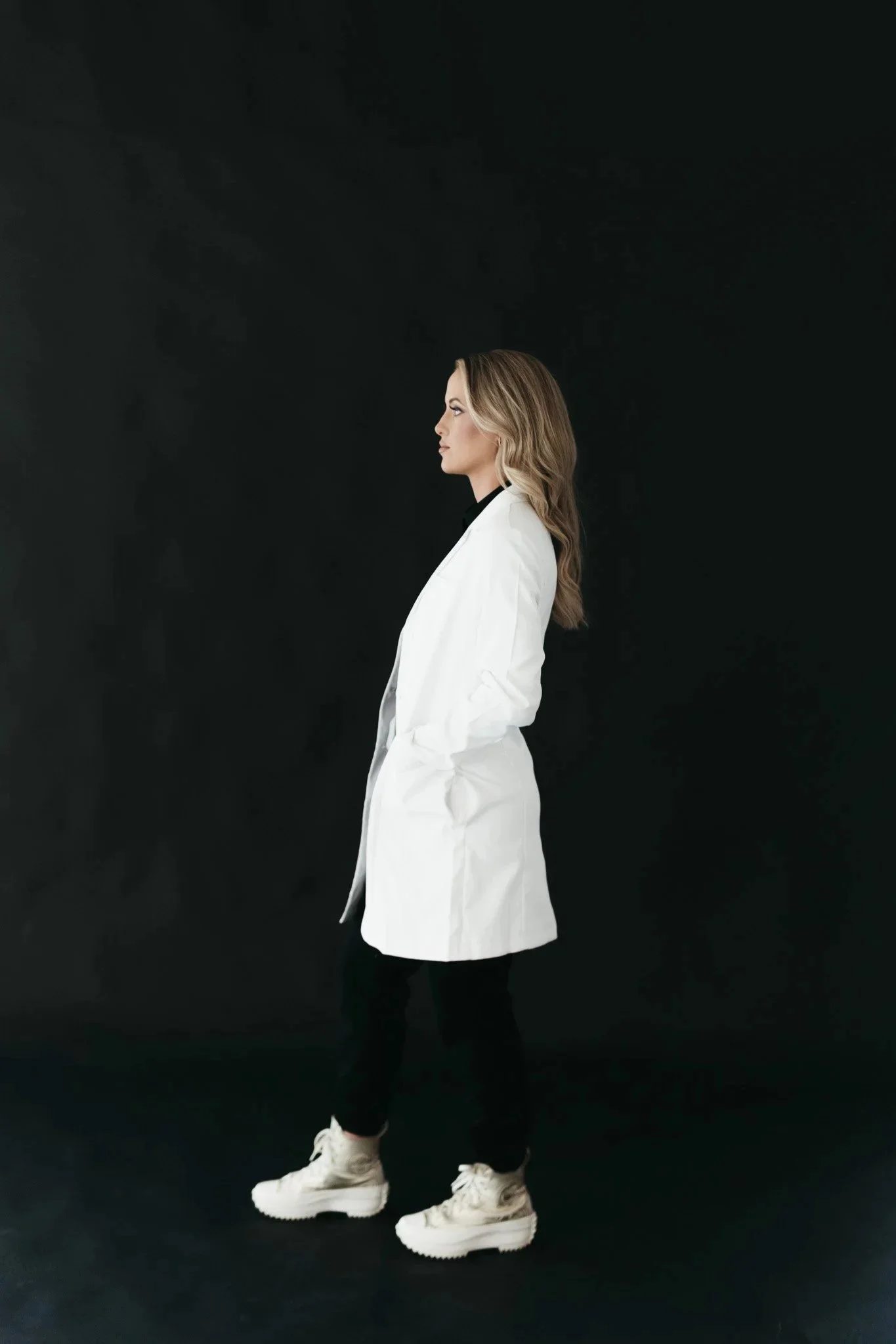 Mikayla Wells, PA-C, wearing her white coat at Southwest Aesthetics+ in Lawton, OK