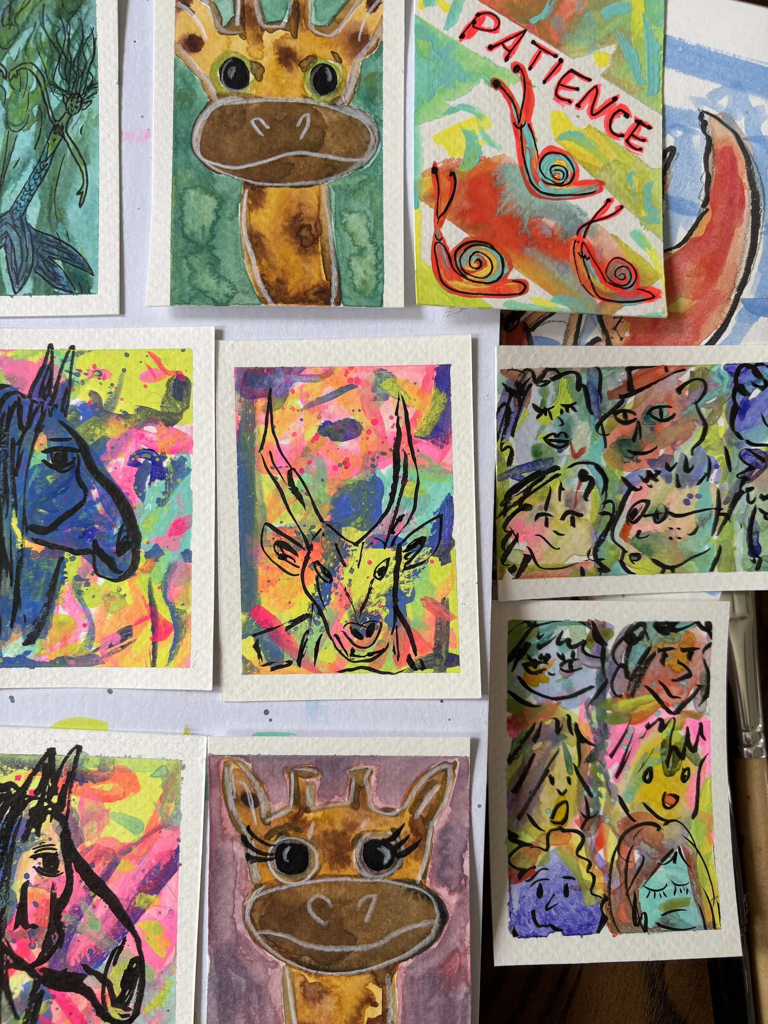 Colorful watercolor paintings of animals and faces, including a giraffe and a fox, with various abstract and expressive backgrounds.