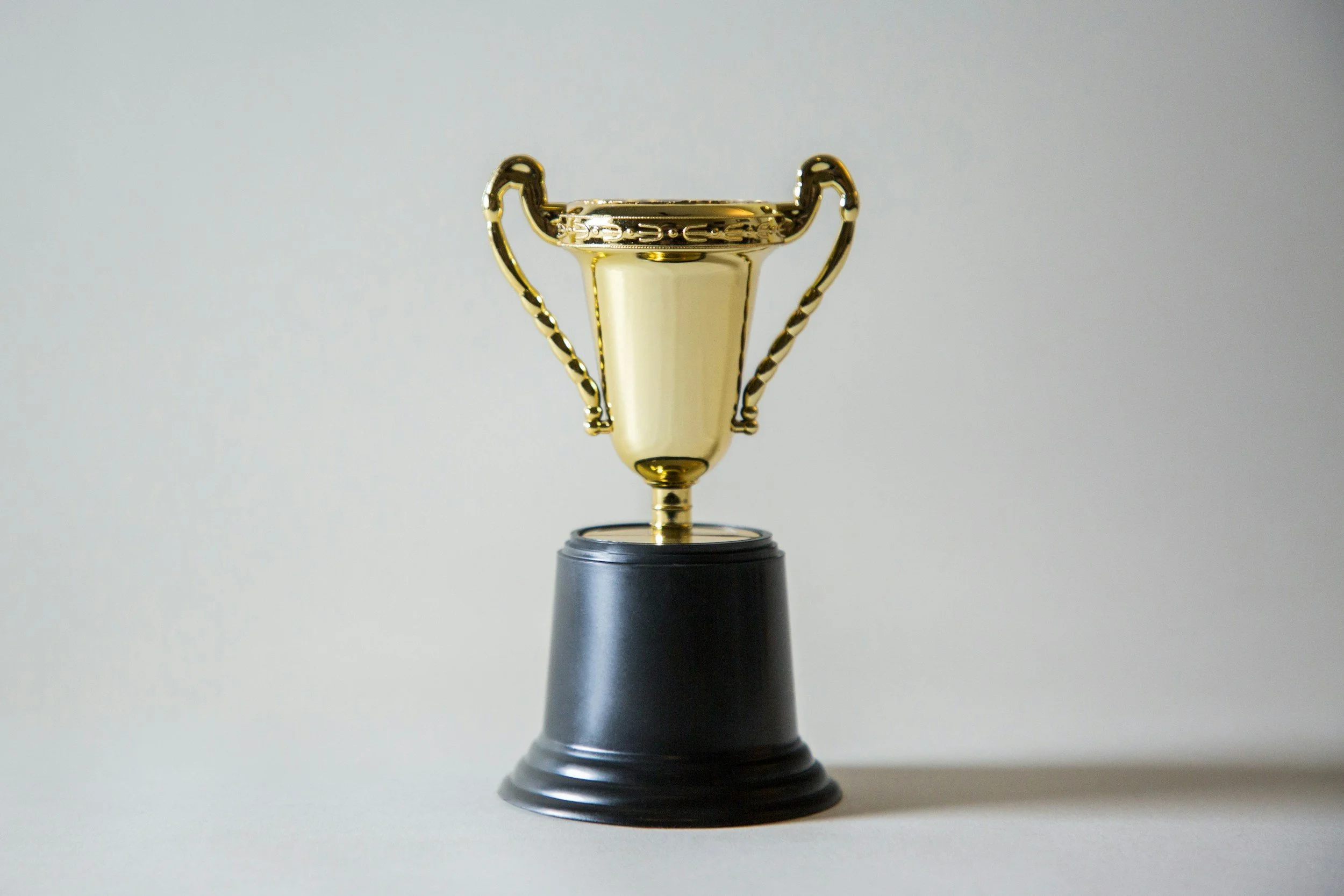 Golden trophy representing marketing success and business growth results delivered by Maverick HQ.