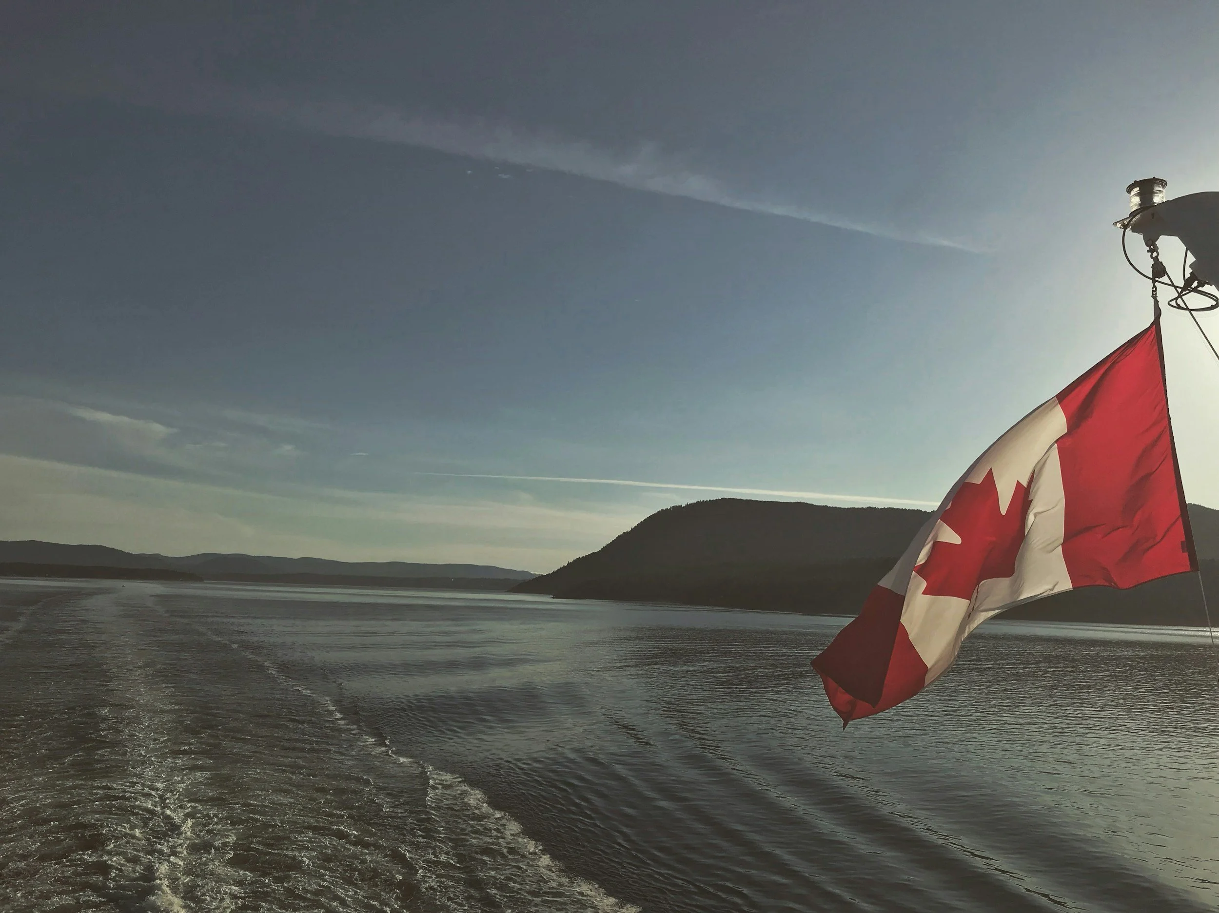 Ontario and Canada flags flying together, representing Maverick HQ's marketing services across Ontario, Canada.