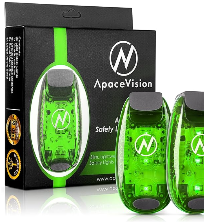 Two green roadside emergency safety lights and their black packaging box with the ApaceVision logo, designed for vehicle safety.