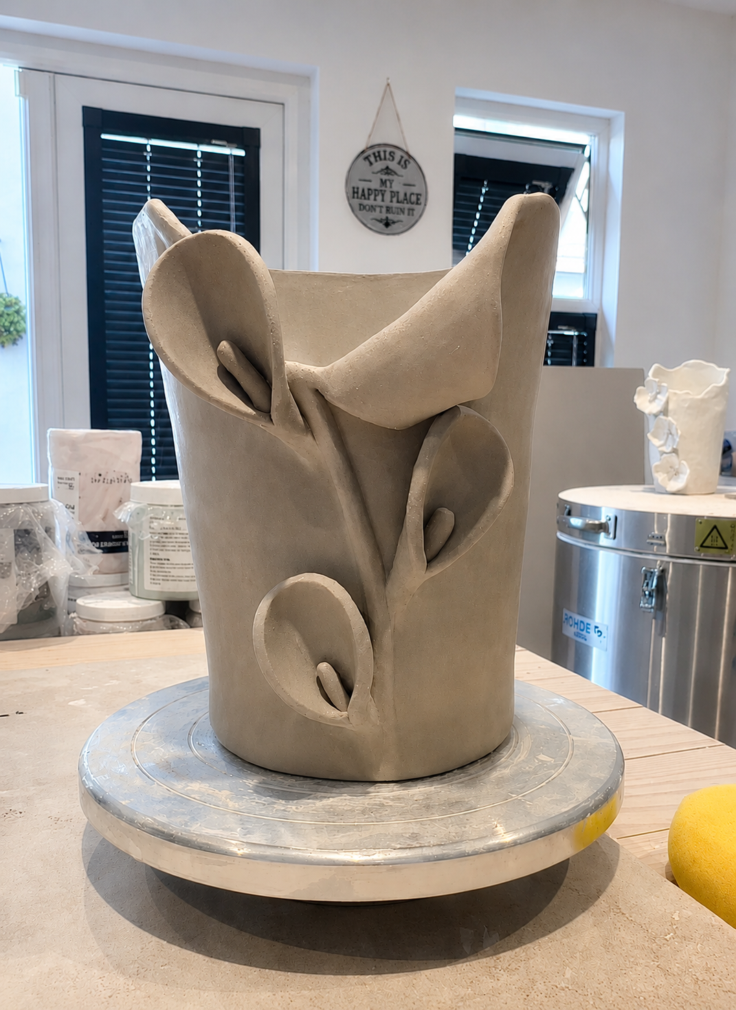 Sculptural ceramic vase in progress on the pottery wheel in the SugarPlum Ceramics studio.
