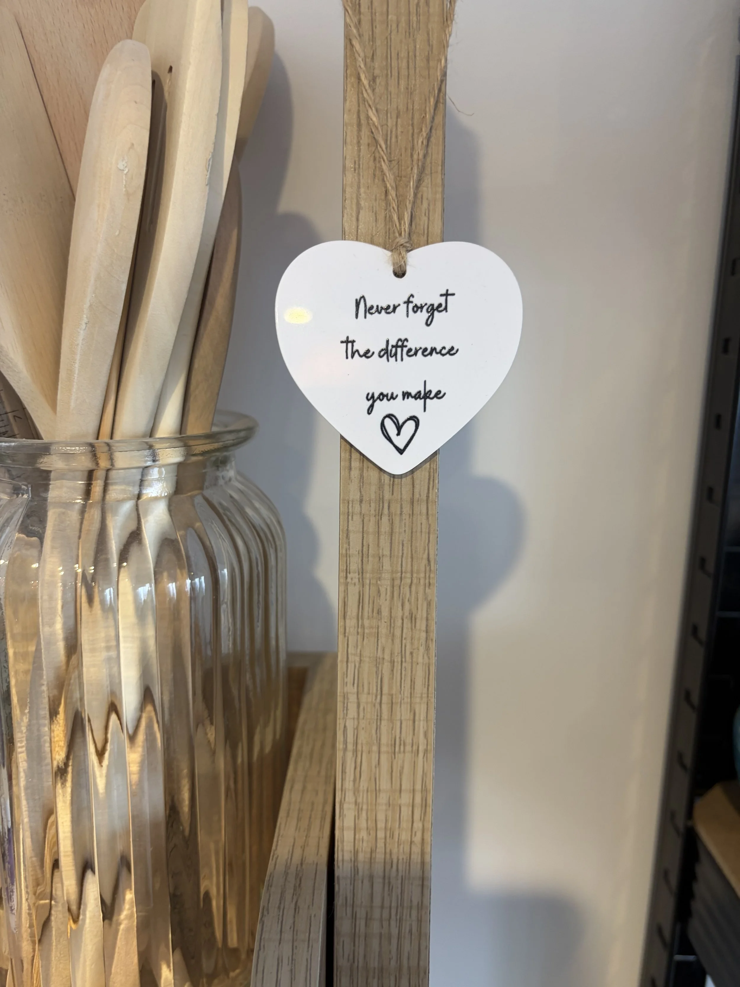 Heart-shaped tag with the message “Never forget the difference you make.”