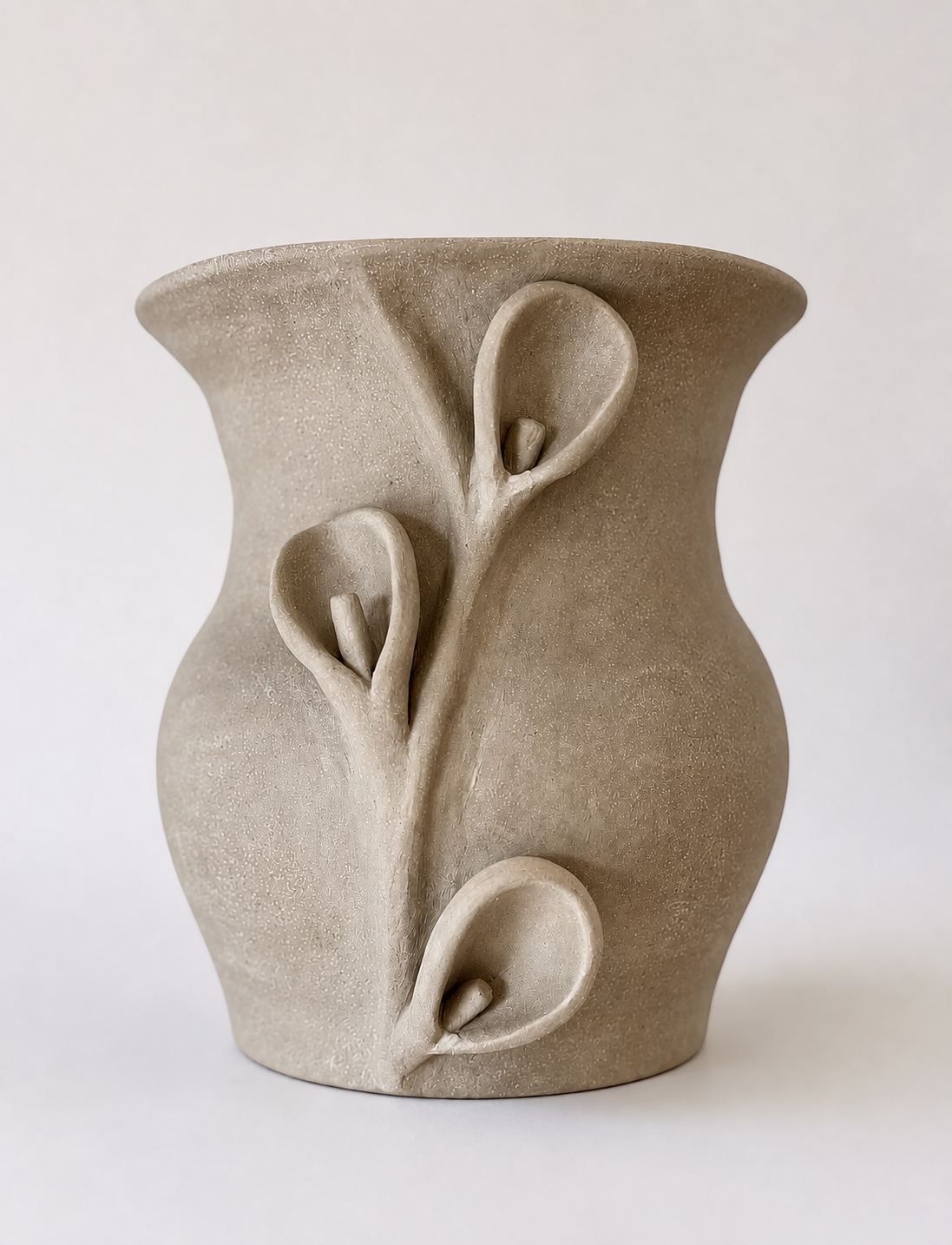 Handcrafted cream sculptural ceramic vase with raised organic floral details.