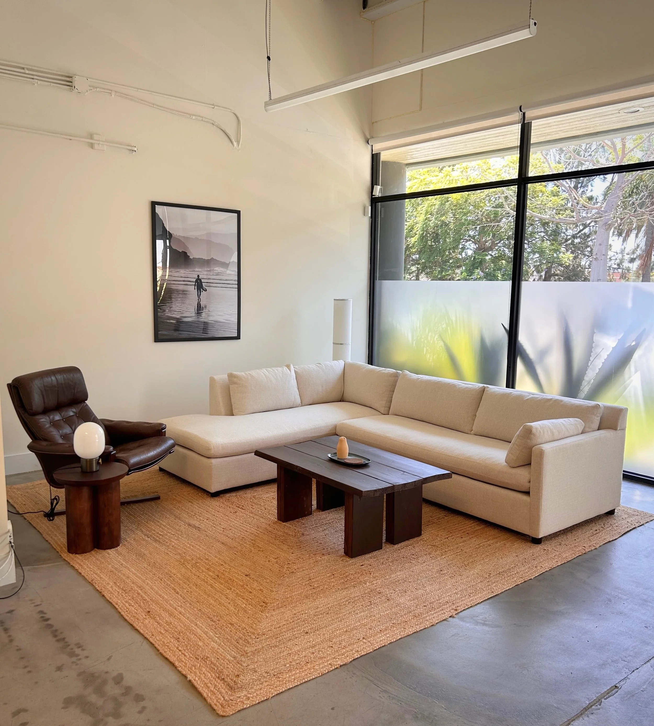 Private consultation lounge with couch at M.P.G. Studio Santa Monica.