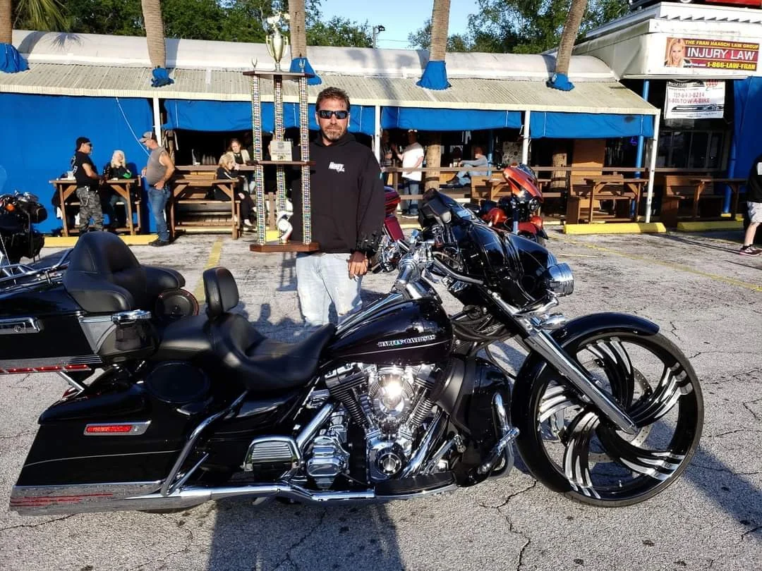 Paul DeGregorio with his custom motorcycle during his early IASCA car audio competition years, where he developed the tuning and installation techniques that now influence Ultimo Marine audio systems.