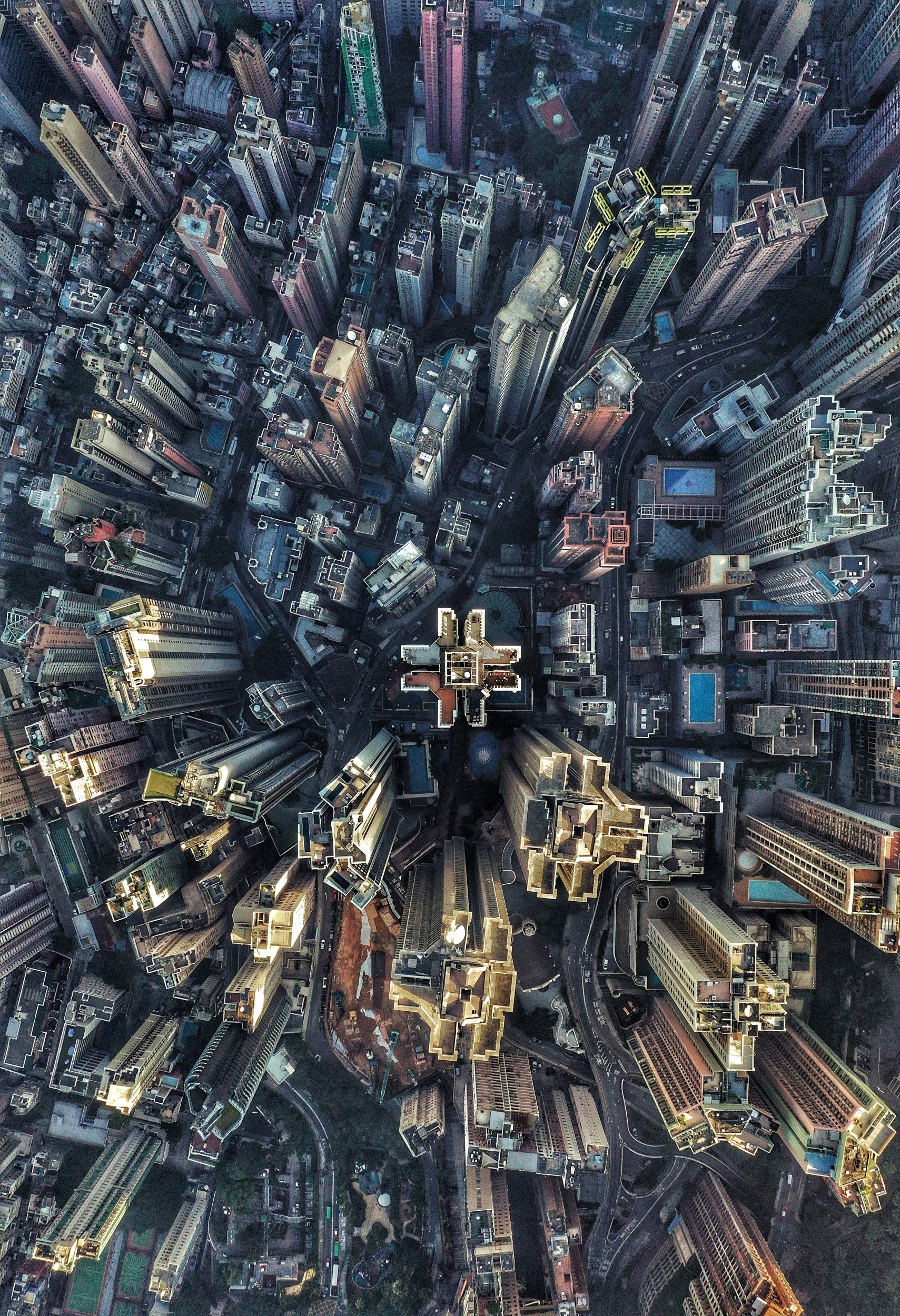 a top down city view of tall buildings