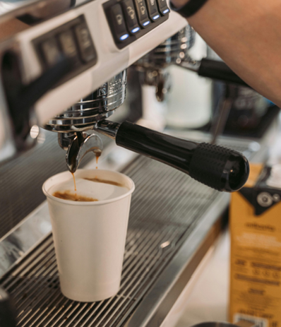 Coffee being prepared at a conference refreshment station.