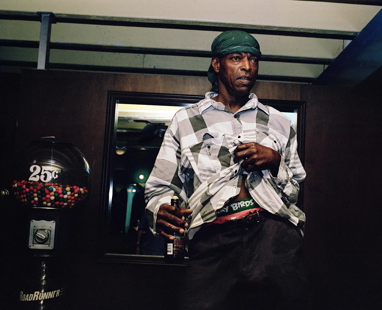 Slim dances during a weekly domino tournament at a club in downtown Belle Glade