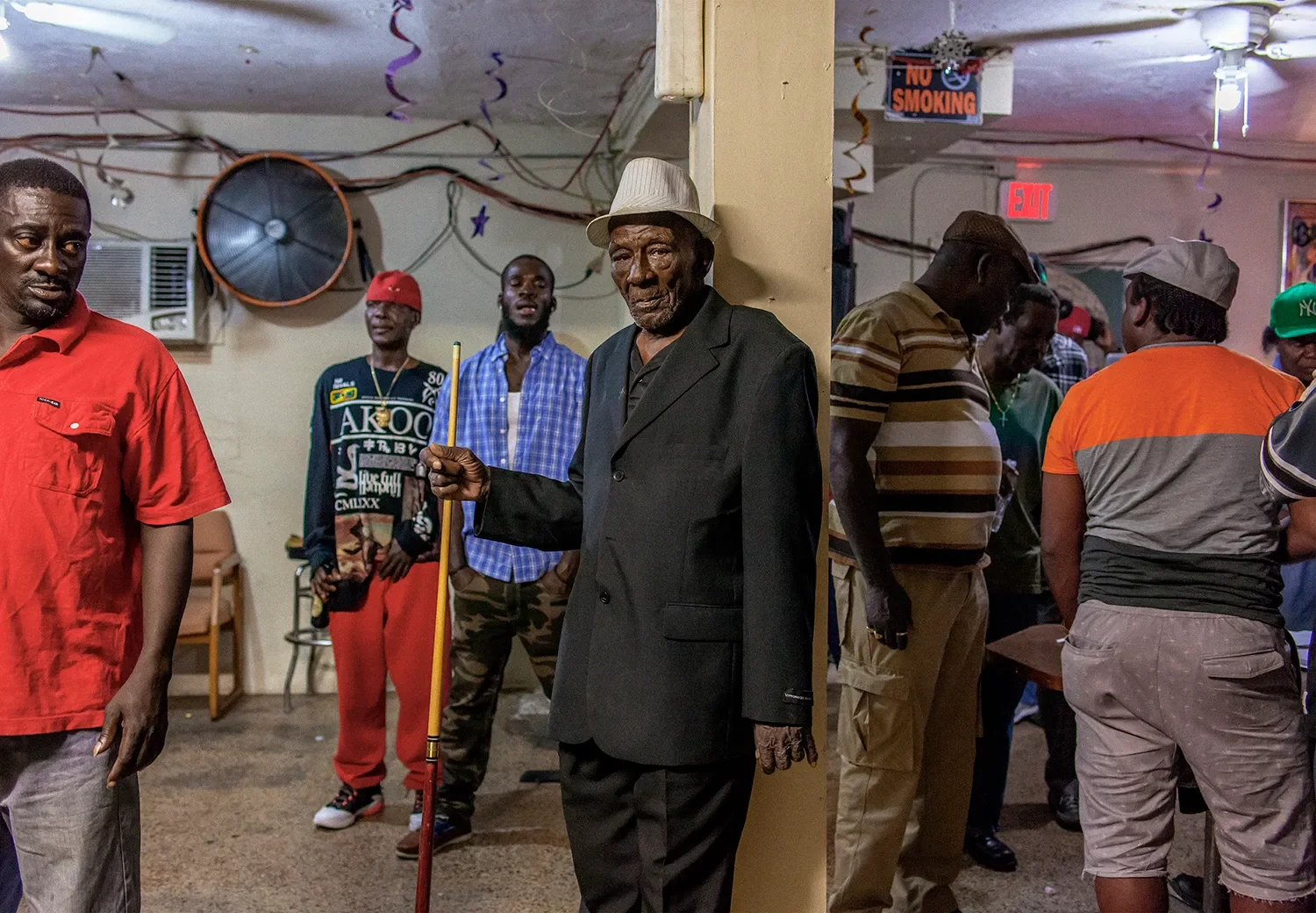 During a party at a club in downtown Belle Glade. Uncle Bill, pictured in the center, was notorious for being an excellent pool player.
