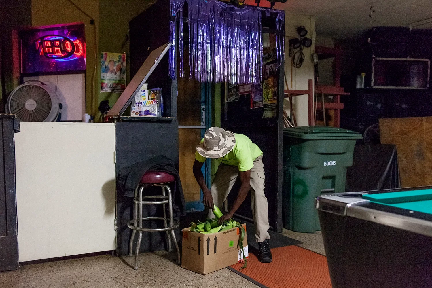 A man offers corn for sale at a bar in downtown Belle Glade.