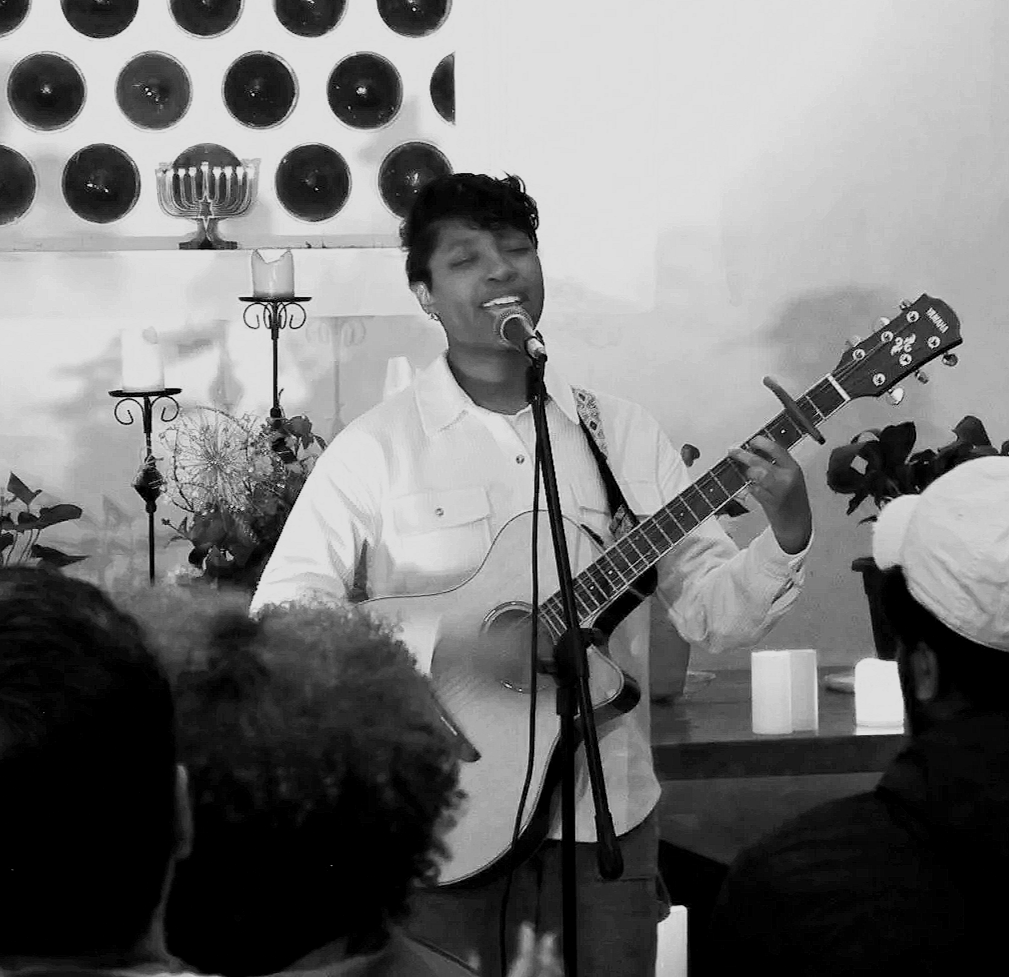 Woman singing and playing guitar at Forever Altr'd Worship Event in Charlotte, NC