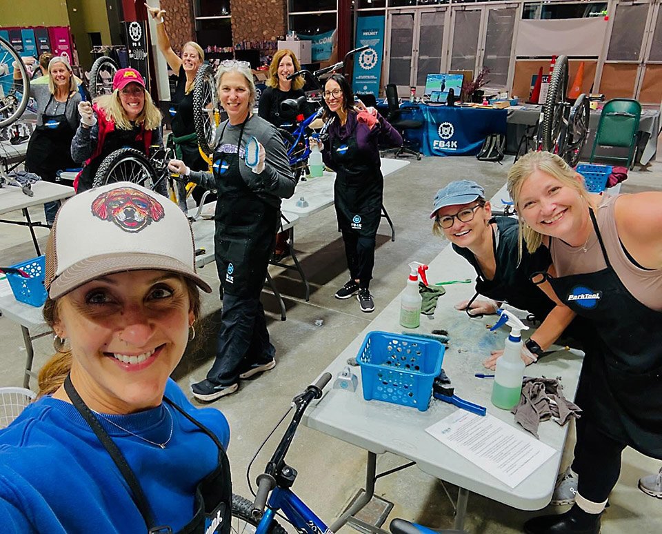 Group of volunteers cleaning bikes
