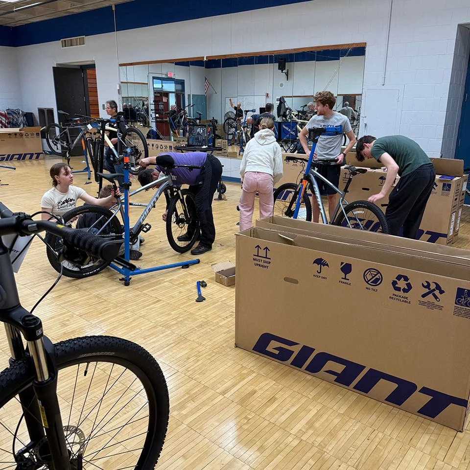 Volunteers building bikes