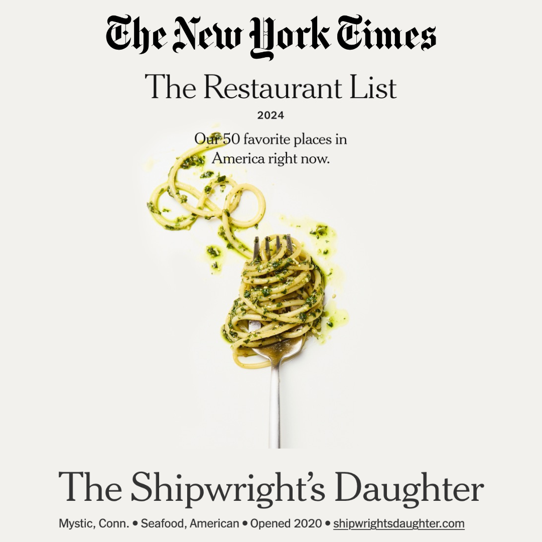Cover of The New York Times restaurant list 2024 featuring a fork twirling spaghetti with green herbs on a white background with text about the top 50 restaurants in America, highlighting The Shipwright's Daughter in Mystic, Connecticut.