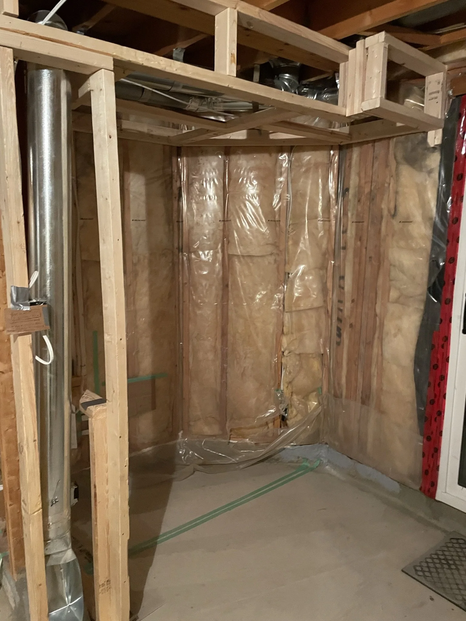Original basement exterior wall before insulation and second bench area finishing.