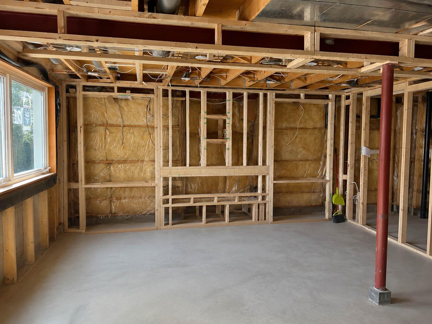 Existing basement fireplace area before the renovation.