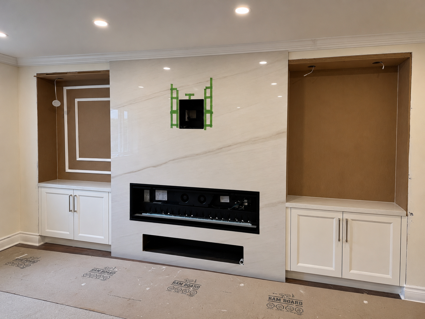 Custom built-in feature wall under construction before finishing.