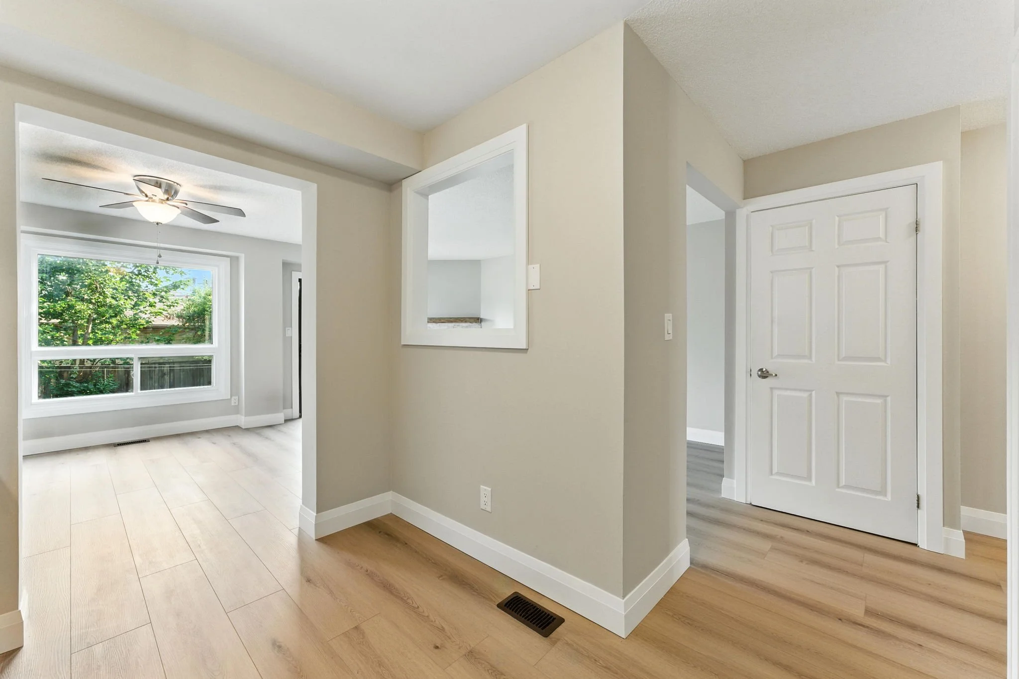 Bright kitchen area connecting seamlessly with living room