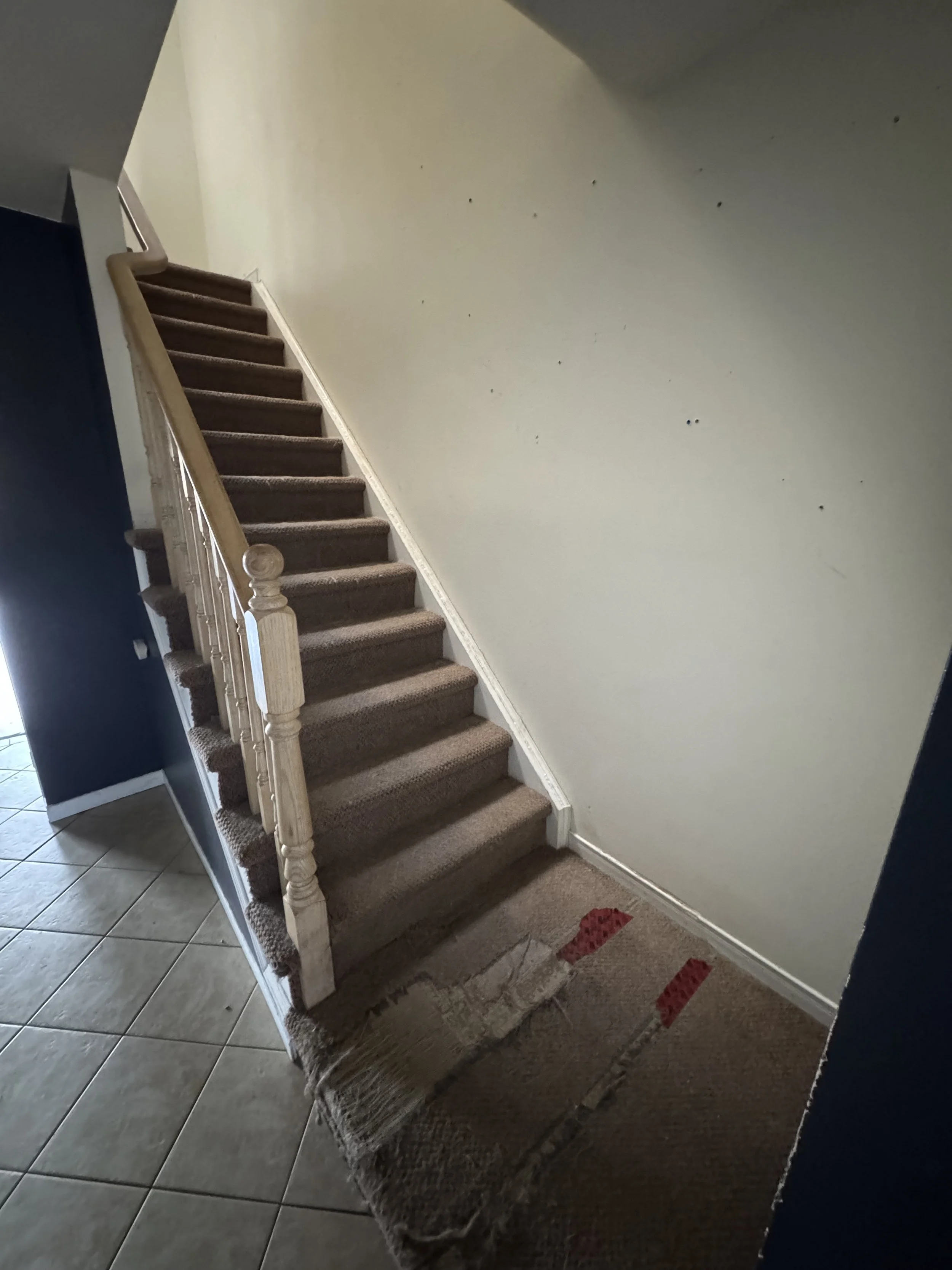Existing staircase to second floor before the renovation began.