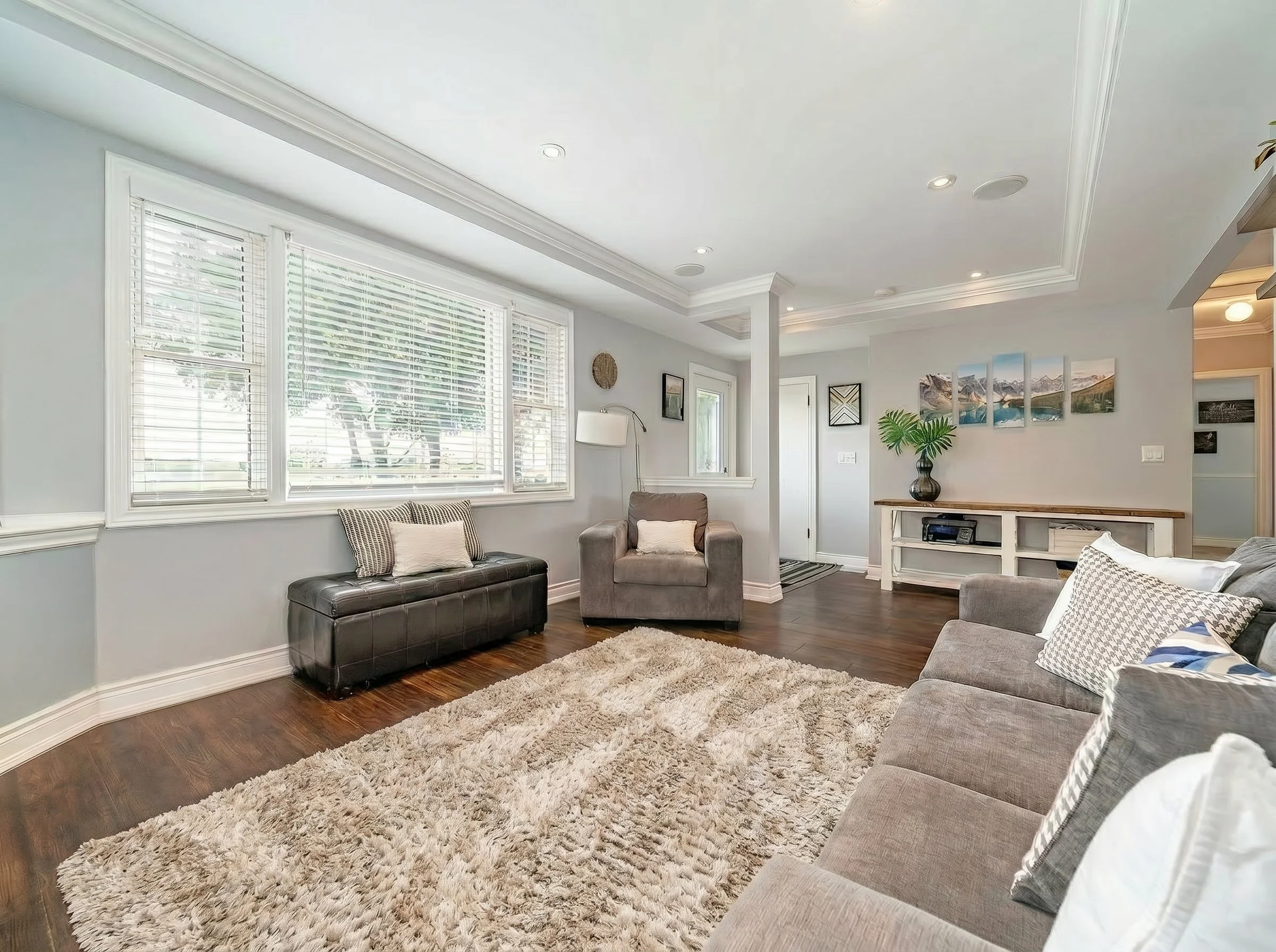 Bright open-concept living space created through a complete home renovation with seamless flow and modern finishes.