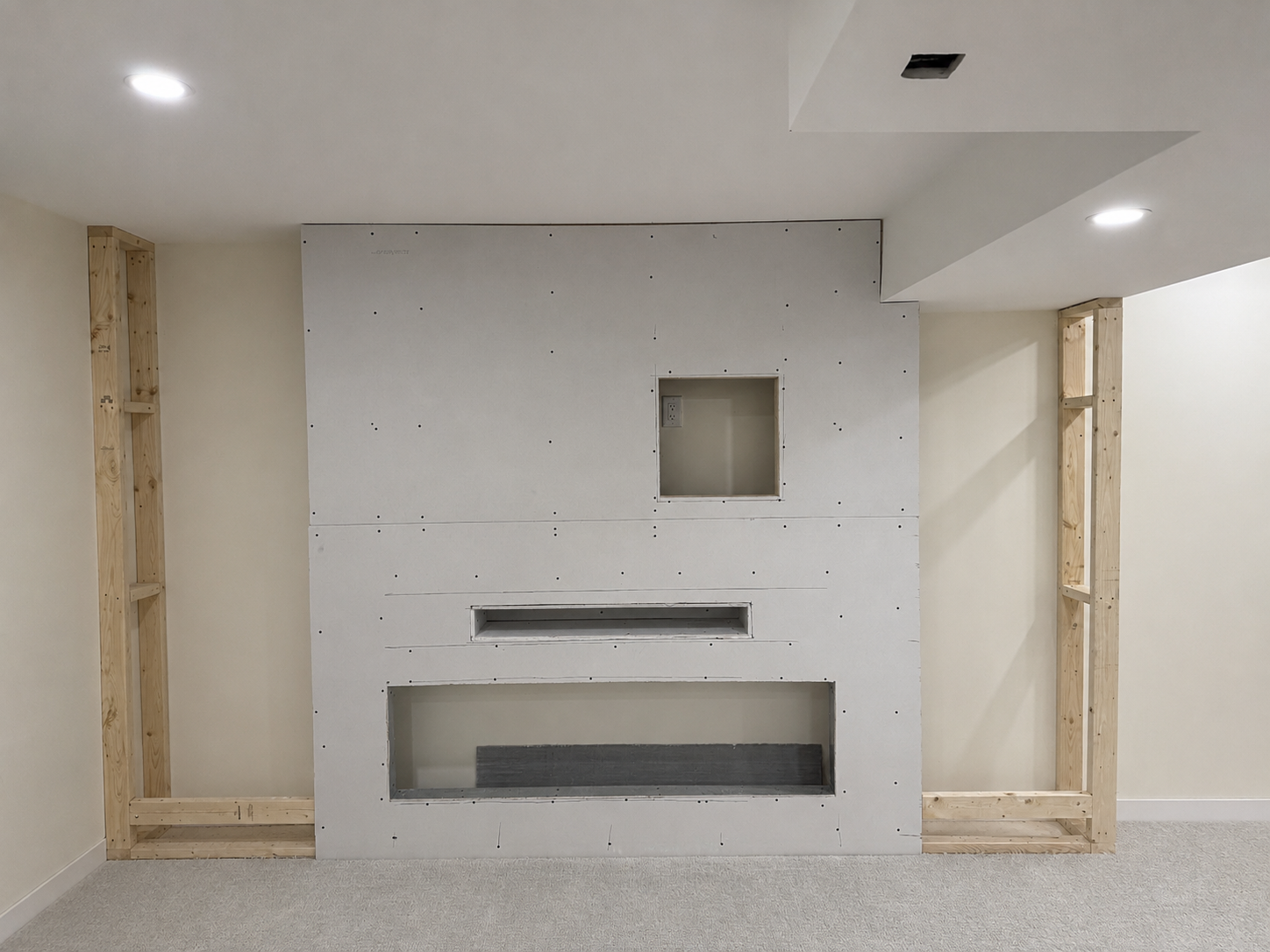 Custom fireplace feature wall during construction.