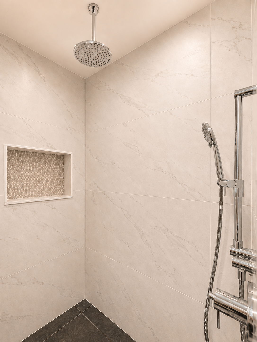 Built-in shower niche finished with clean tile detailing.