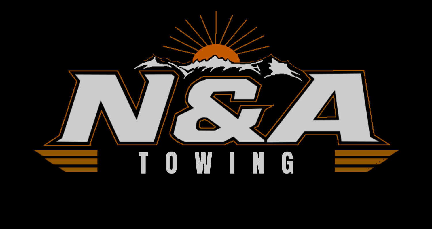 Logo for N&A Towing featuring mountain peaks, a sunrise, and stylized text.