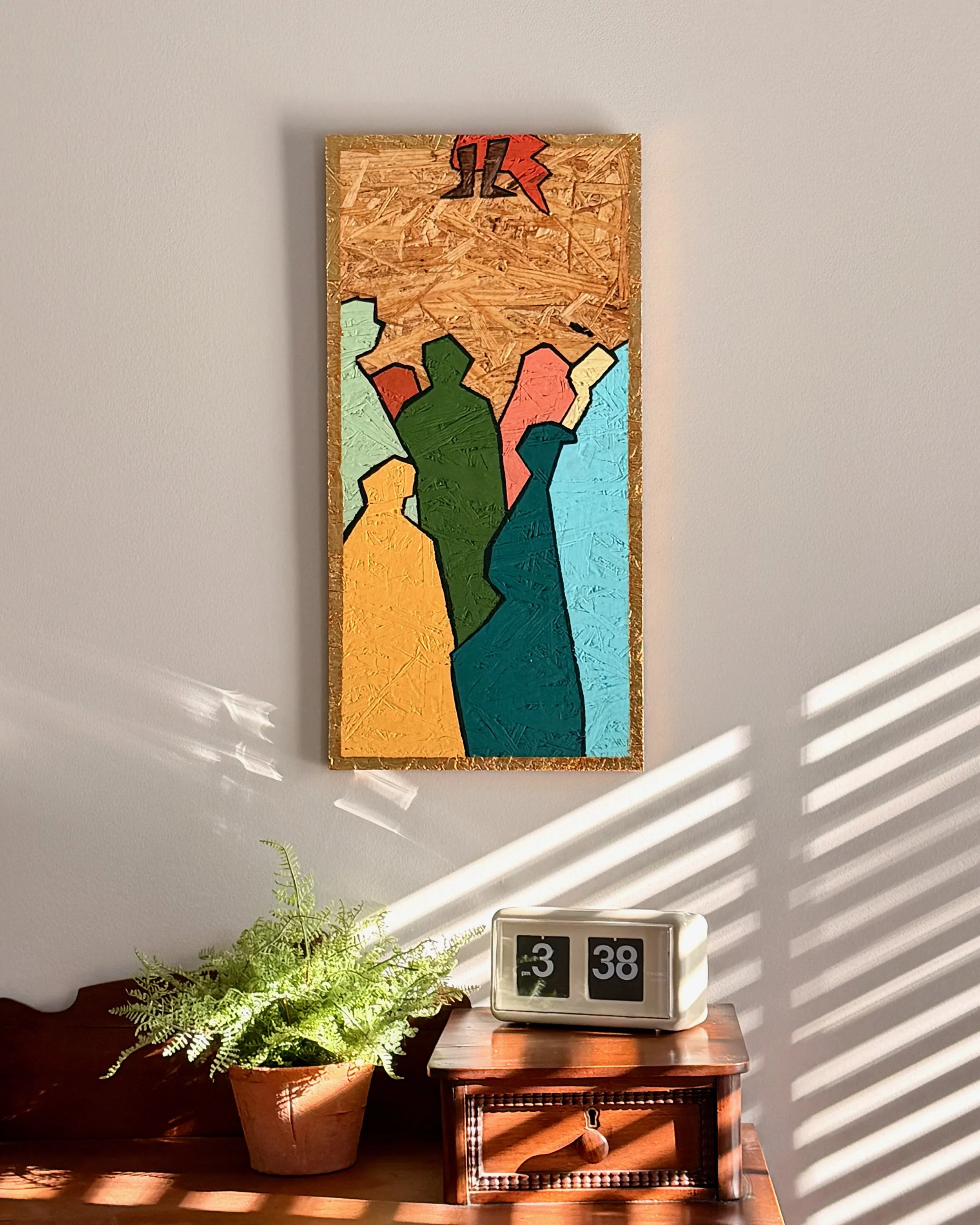 A decorative wall art piece with abstract figures in bright colors hangs above a vintage wooden nightstand. On the nightstand, there's a retro-style clock showing 3:38, and a potted fern plant is placed to the left of the clock. Sunlight creates stri