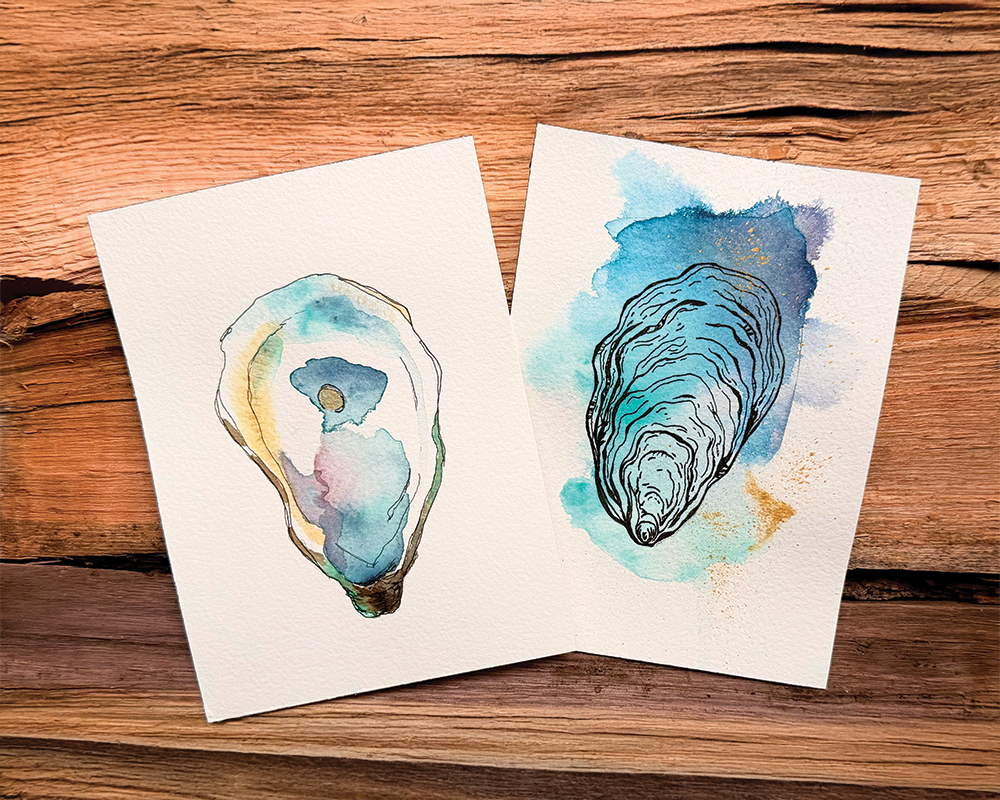 Two watercolor paintings of seashells on a wooden surface.