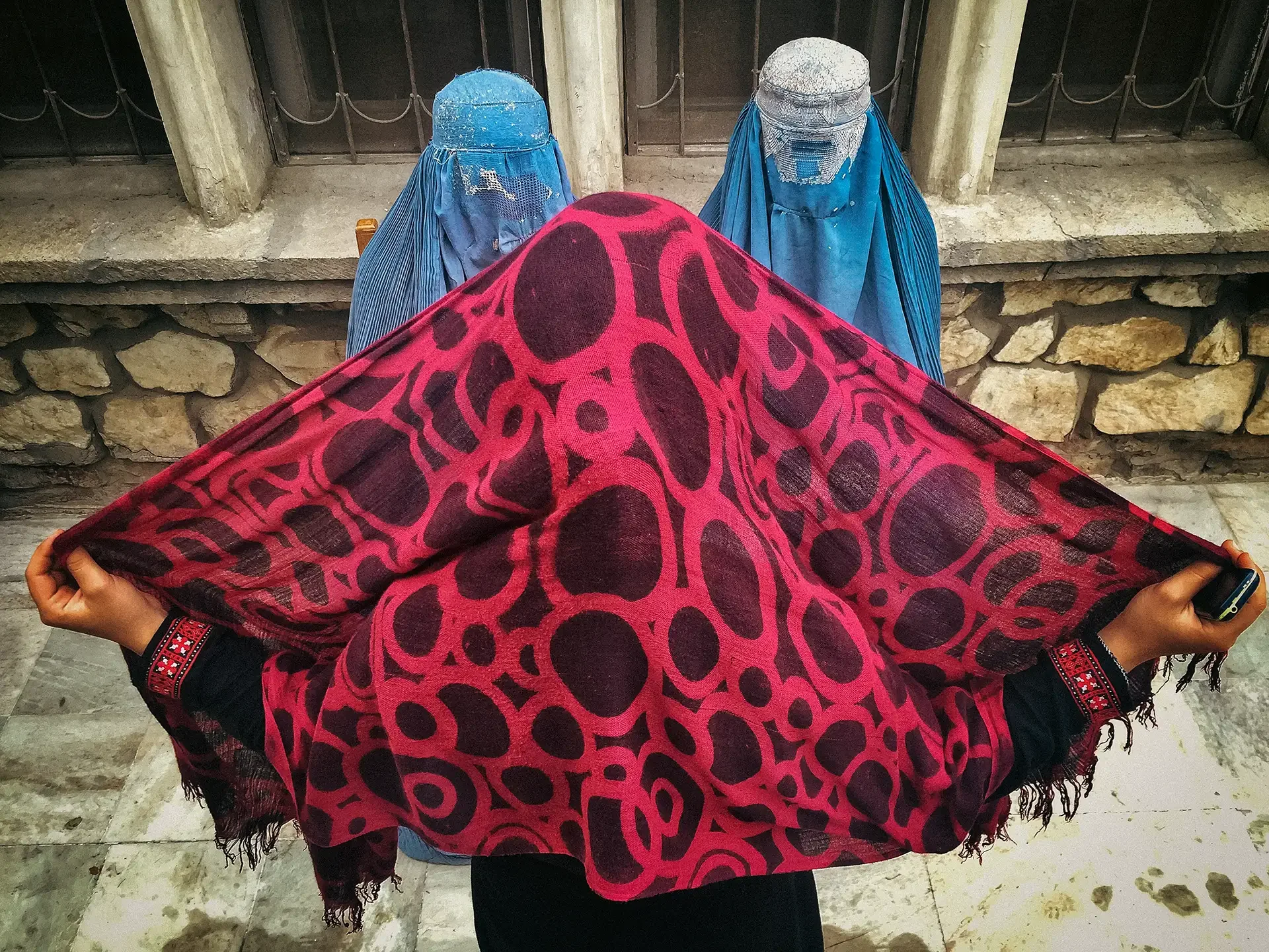 Visual ethnography capturing women in traditional burqas, Afghanistan.