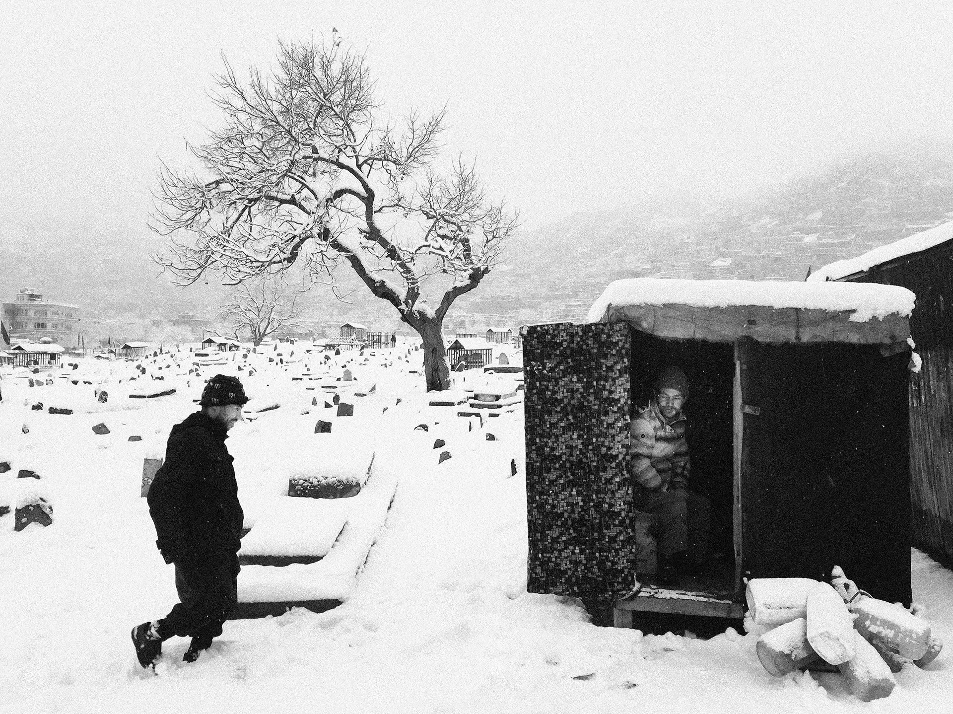 Documentary photography capturing a person in a snowy landscape, Afghanistan.⁠